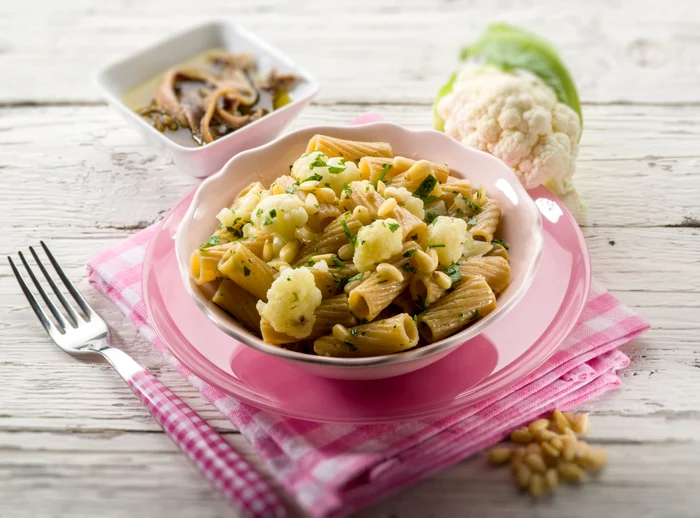 24935808   pasta with cauliflower ancovy and pine nuts, selective focus jpeg