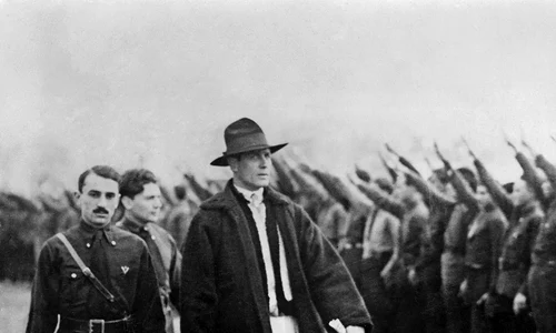 Romanian Politician Corneliu Zelea Codreanu wears Romanian peasant dress inspecting Iron guards fascist movement 1934 webp