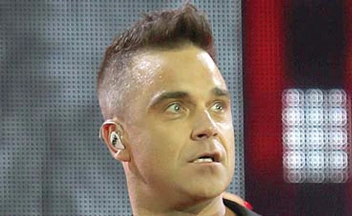 Robbie Williams nu a fost deloc un băiat cuminte în tinereţe, dar i-a venit mintea la cap după ce s-a însuratFoto: Guliver / Splashnews